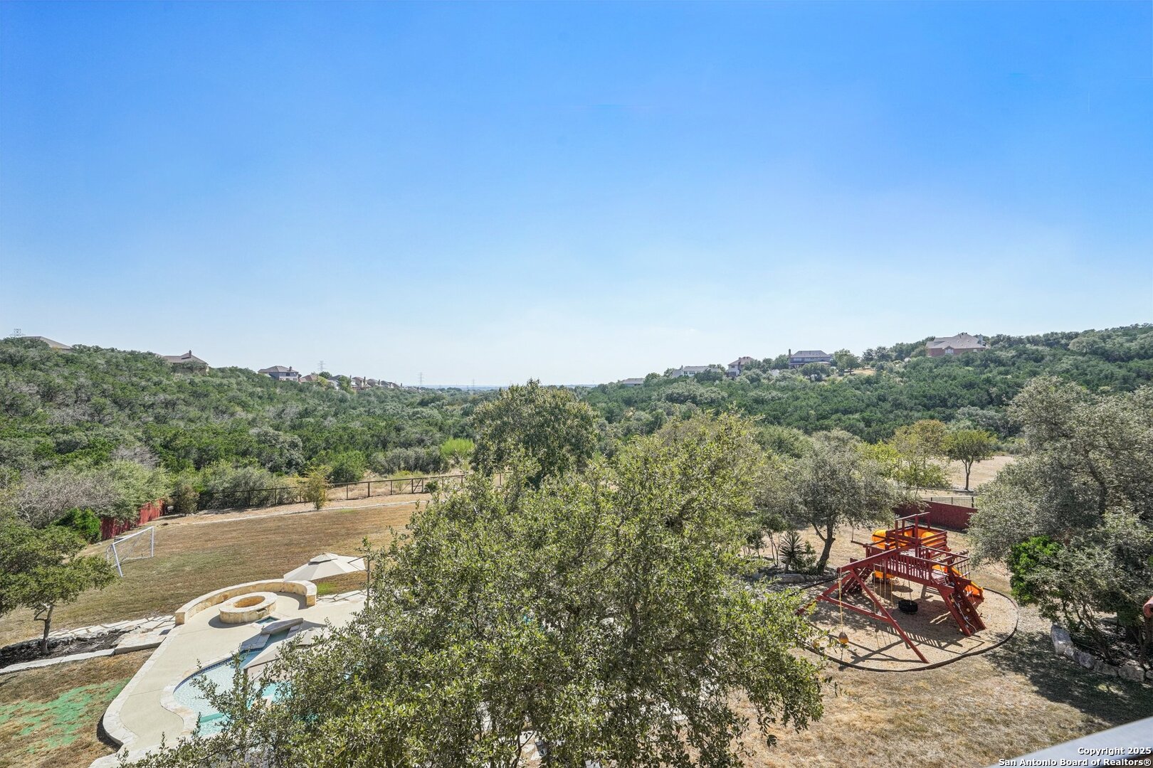 718 Ruidosa Downs Helotes, TX 78023 - Photo 34 of 50 a view of a lake with a city