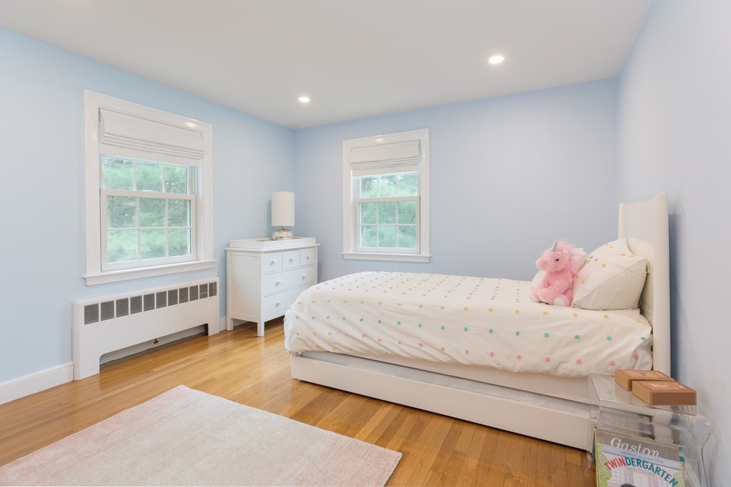 88 Lindbergh Avenue Needham, MA 02494 - Photo 13 of 26 a bedroom with a bed and a window