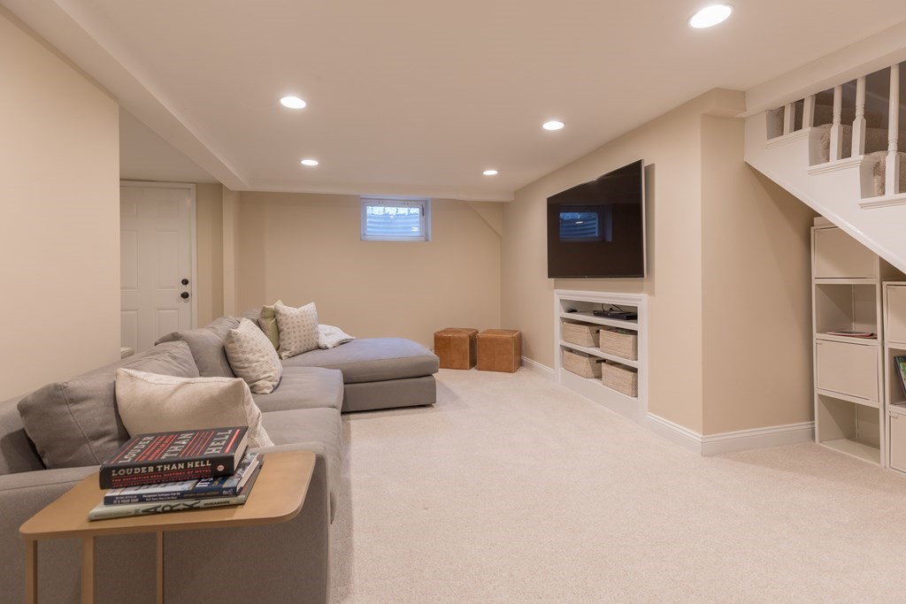 88 Lindbergh Avenue Needham, MA 02494 - Photo 19 of 26 a living room with furniture and a flat screen tv