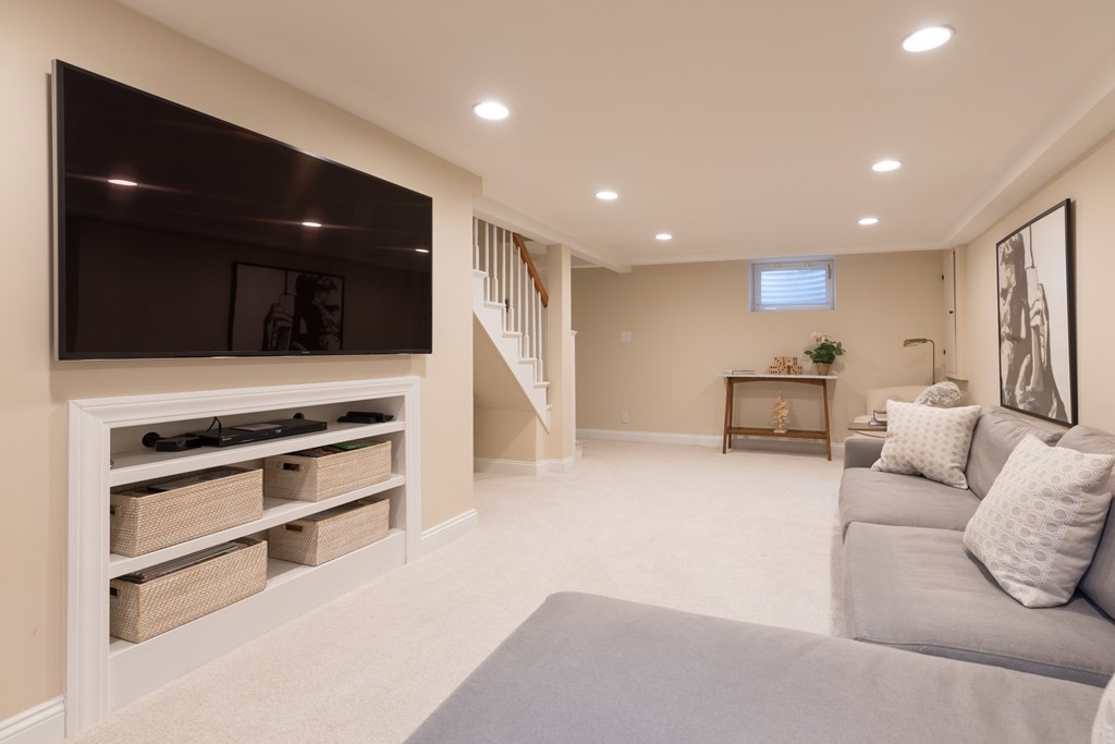 88 Lindbergh Avenue Needham, MA 02494 - Photo 20 of 26 a living room with furniture and a flat screen tv