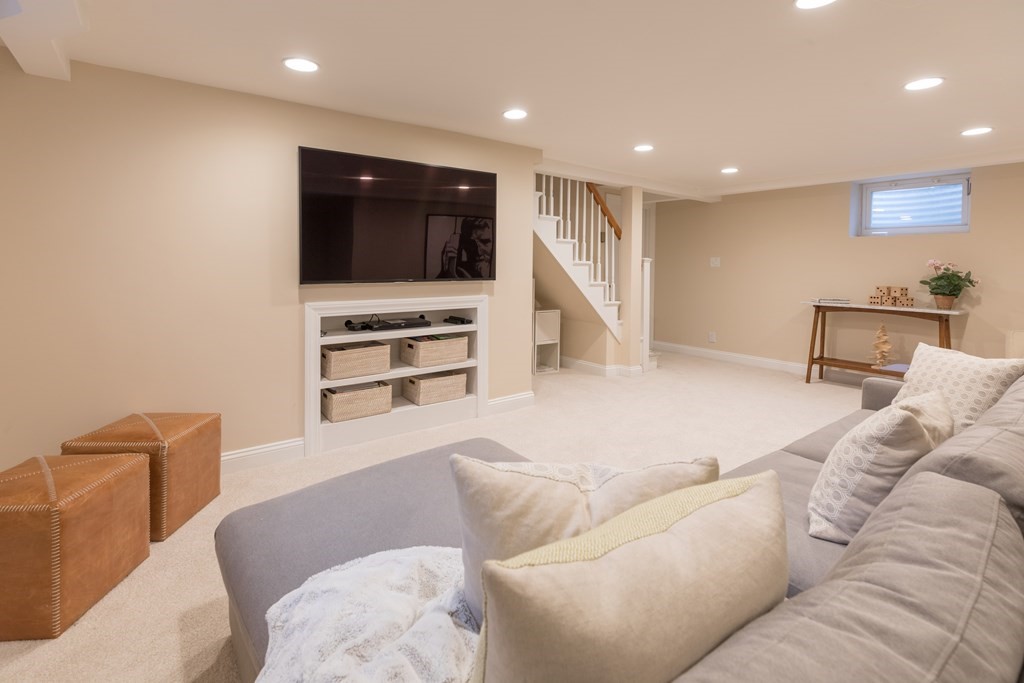 88 Lindbergh Avenue Needham, MA 02494 - Photo 21 of 26 a living room with furniture and a flat screen tv