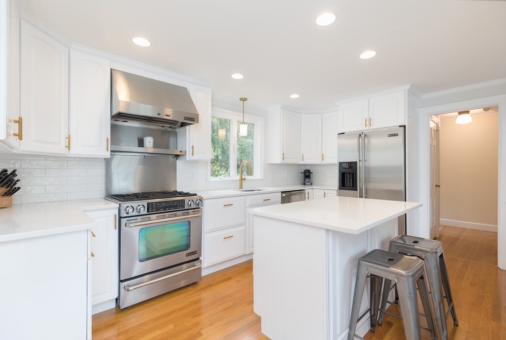 88 Lindbergh Avenue Needham, MA 02494 - Photo 3 of 26 a kitchen with stainless steel appliances a stove refrigerator sink and cabinets