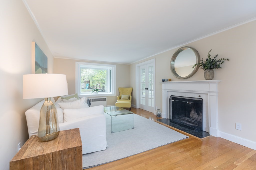 88 Lindbergh Avenue Needham, MA 02494 - Photo 5 of 26 a living room with furniture a window and a fireplace