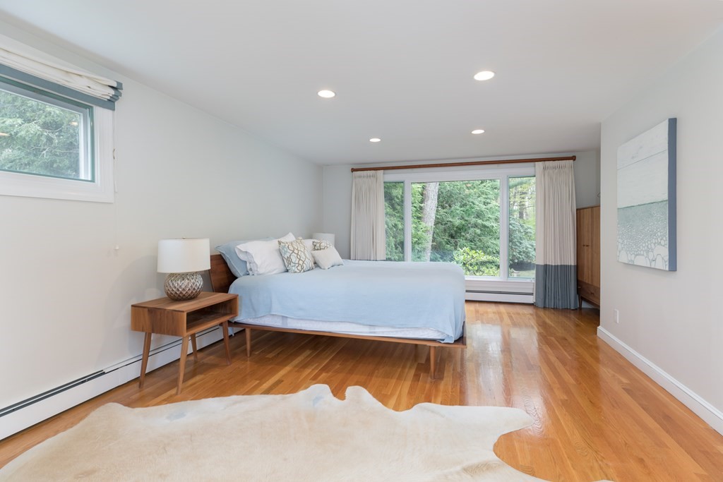 88 Lindbergh Avenue Needham, MA 02494 - Photo 10 of 26 a bed room with a bed and a chair