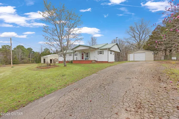 a view of house with a yard