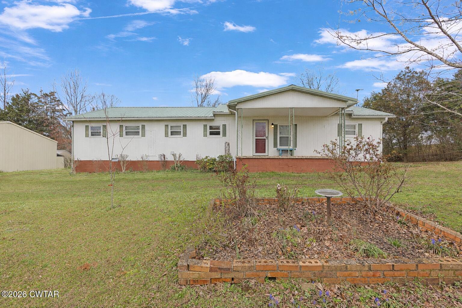 65 Aldridge Lane Jackson, TN 38305 - Photo 2 of 14 a view of a house with a yard