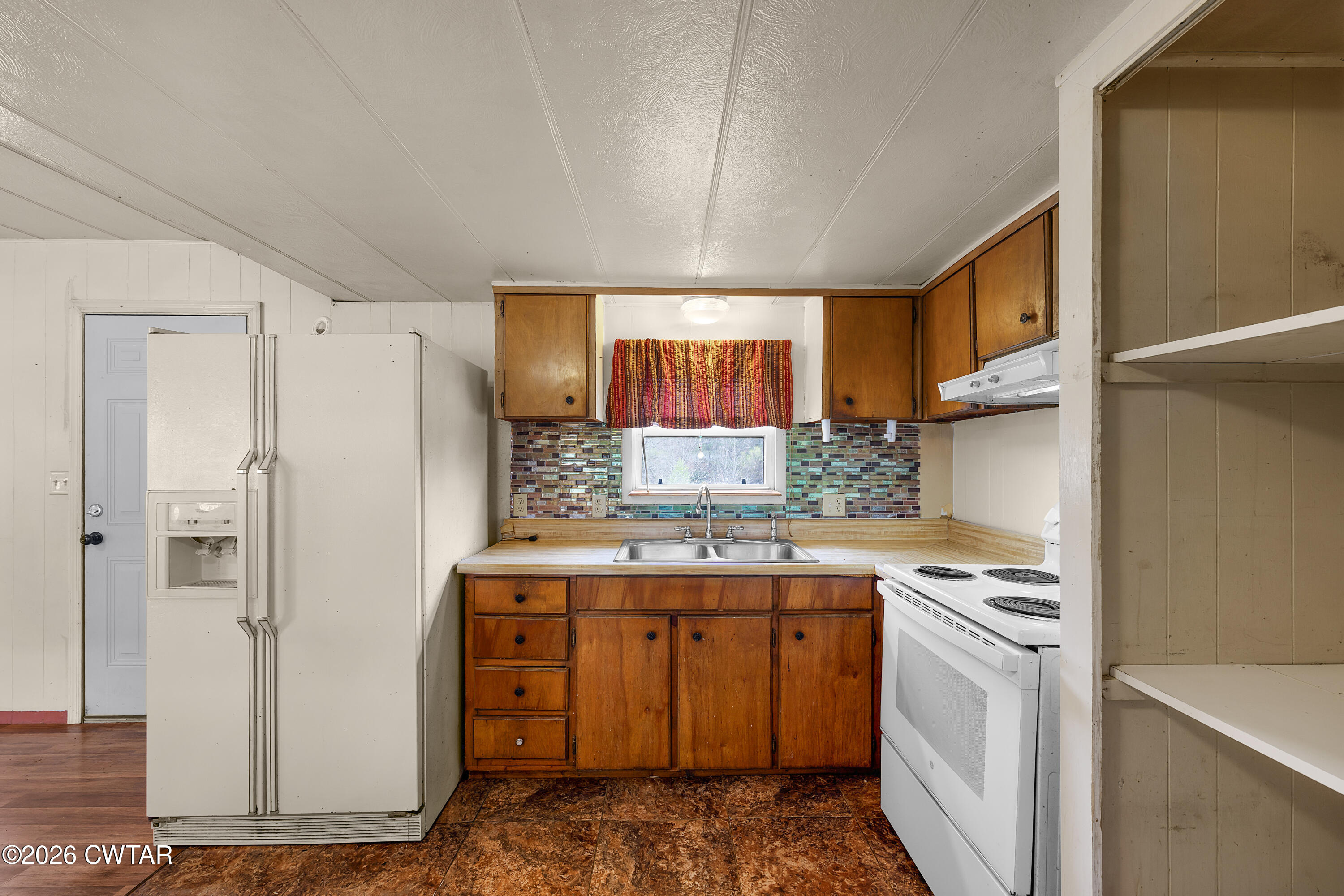 65 Aldridge Lane Jackson, TN 38305 - Photo 6 of 14 a kitchen with stainless steel appliances a refrigerator sink and cabinets
