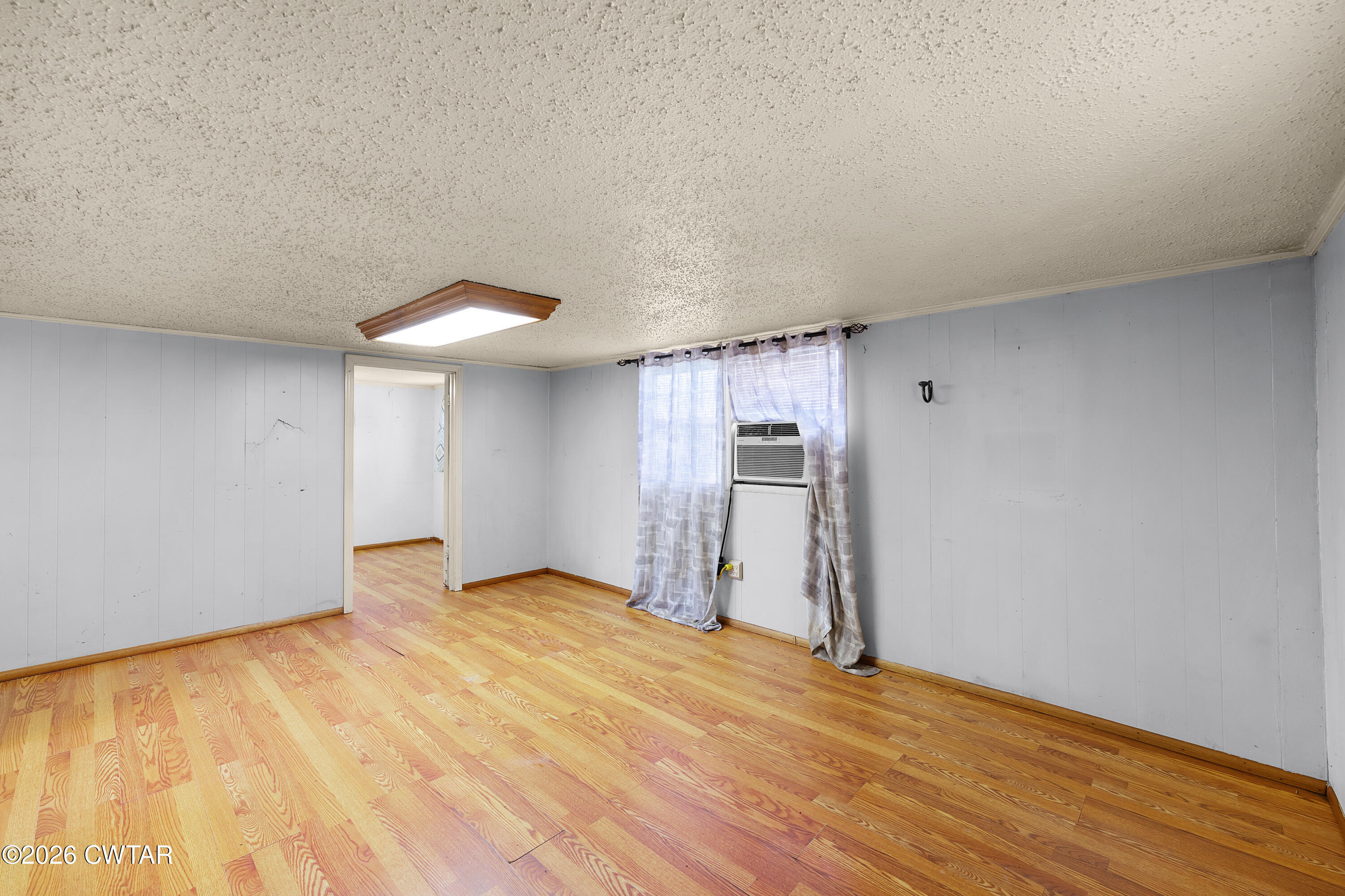 65 Aldridge Lane Jackson, TN 38305 - Photo 7 of 14 a view of empty room with wooden floor