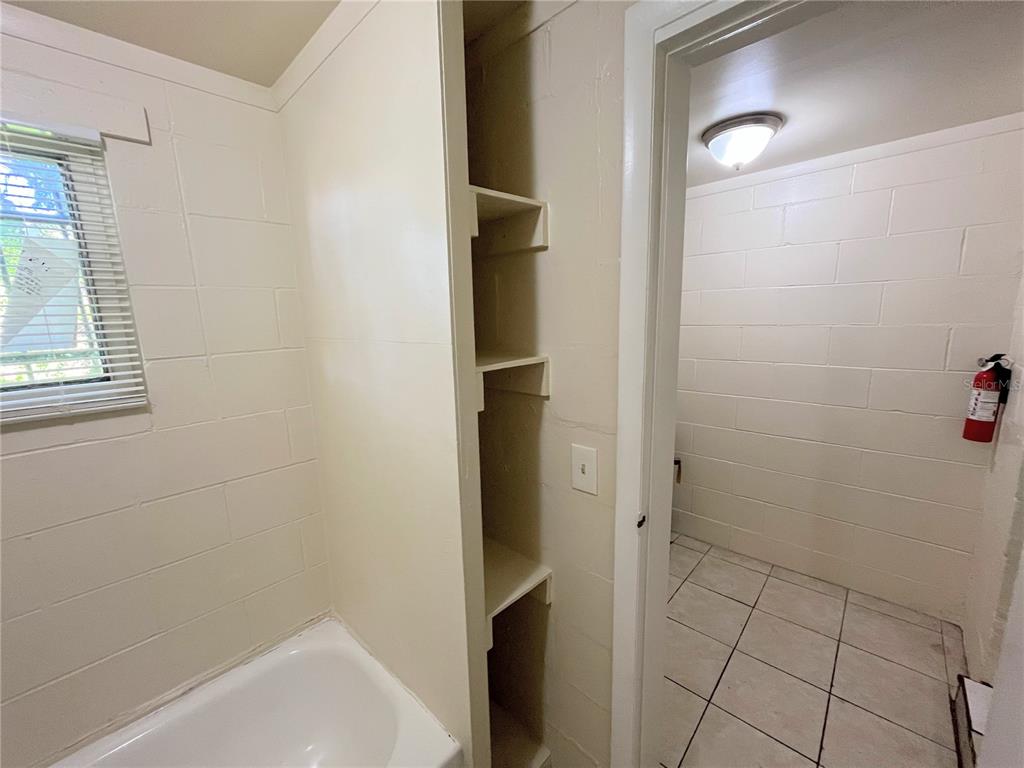 1235 Cypress Street, Unit 1/2 Orlando, FL 32805 - Photo 14 of 19 a bathroom with a bathtub
