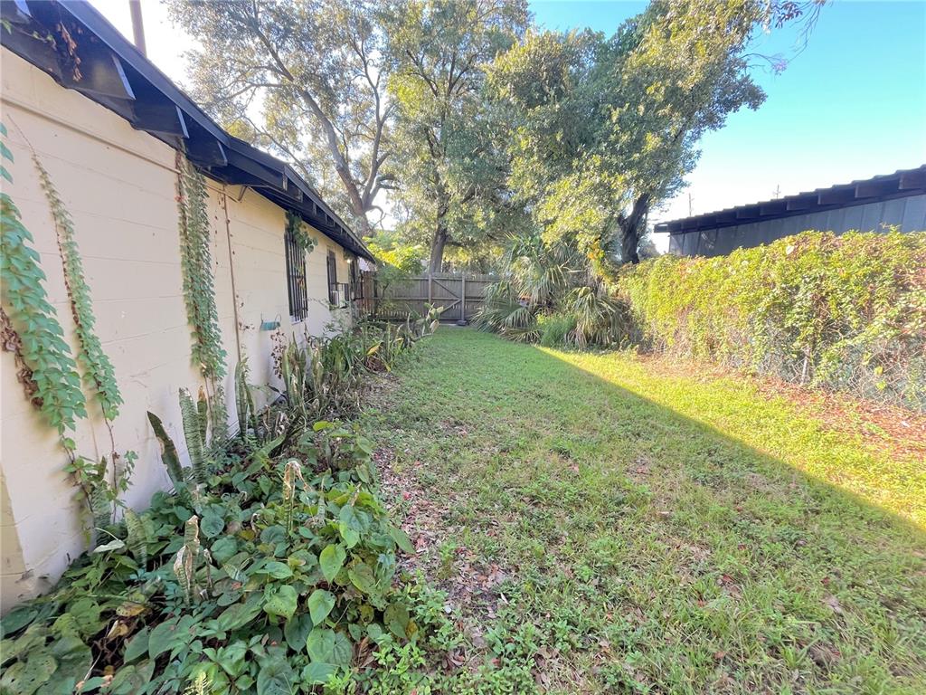 1235 Cypress Street, Unit 1/2 Orlando, FL 32805 - Photo 17 of 19 a view of backyard with green space