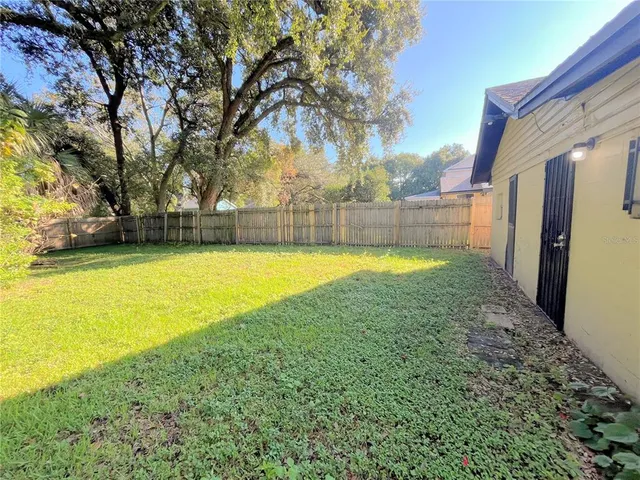 a view of a swimming pool with an outdoor space and seating area