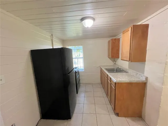 a white refrigerator freezer sitting in a kitchen