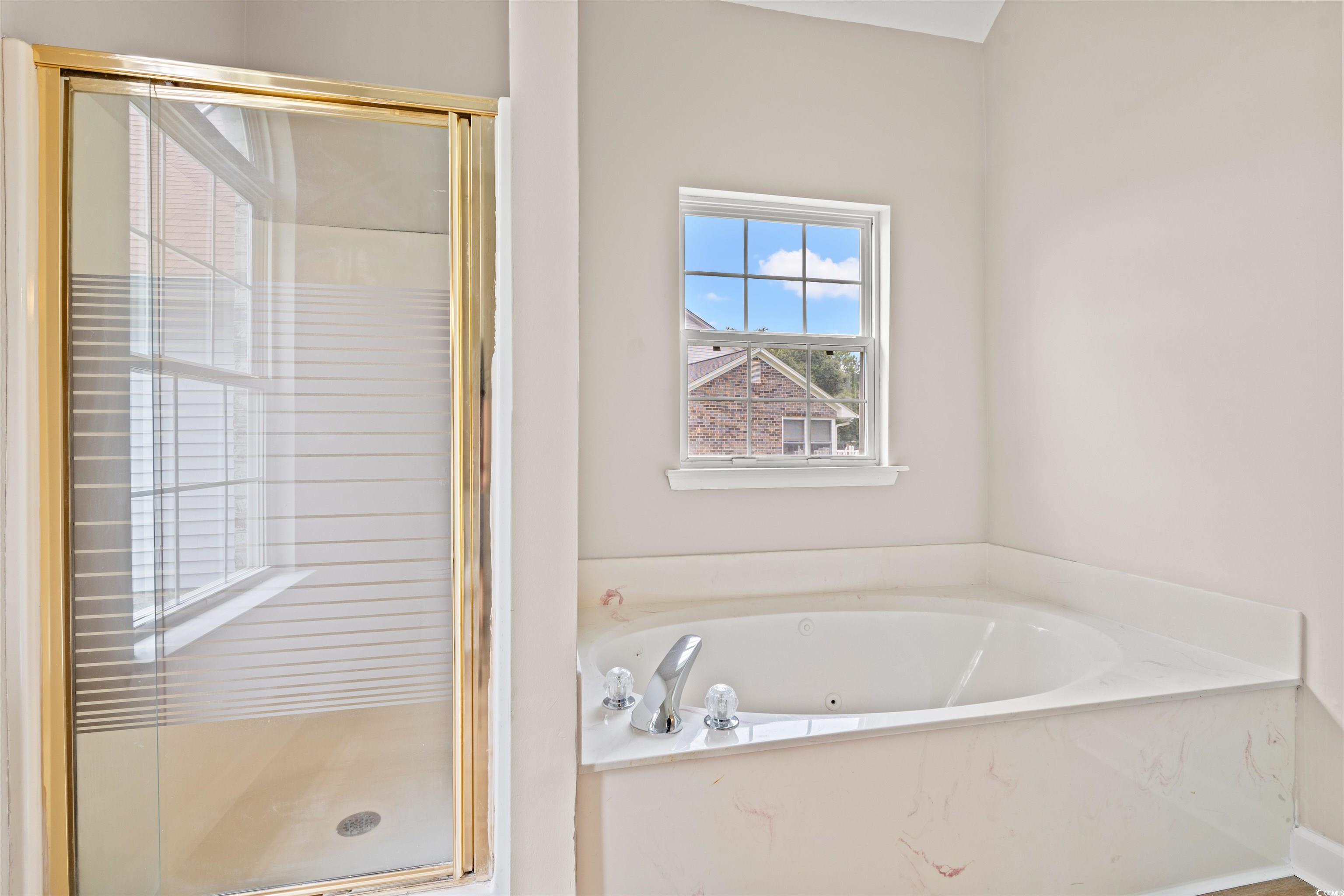 210 Ashley River Road Myrtle Beach, SC 29588 - Photo 14 of 39 Bathroom with a shower stall and a bath