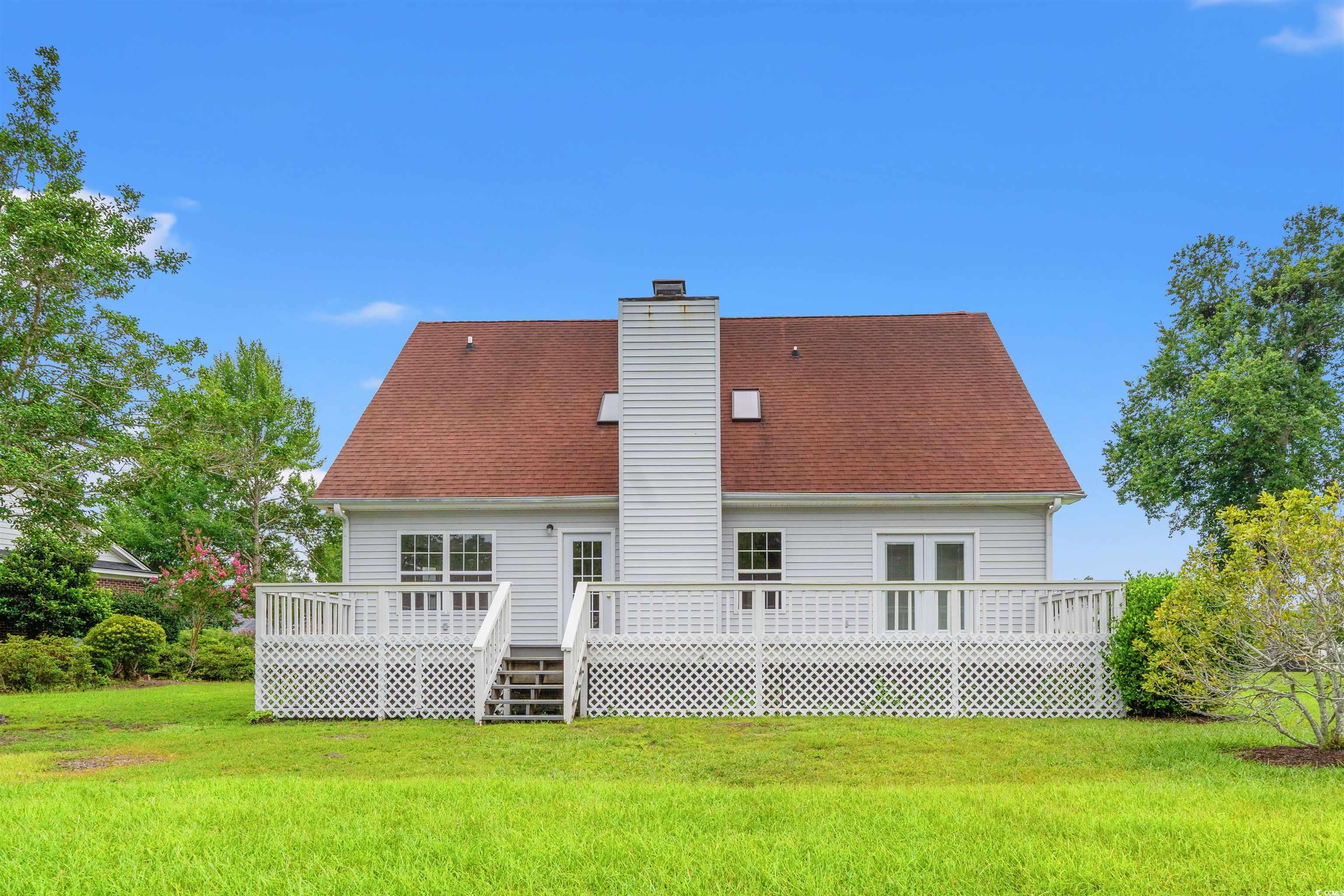 210 Ashley River Road Myrtle Beach, SC 29588 - Photo 29 of 39 Back of property featuring a wooden deck, a yard,
