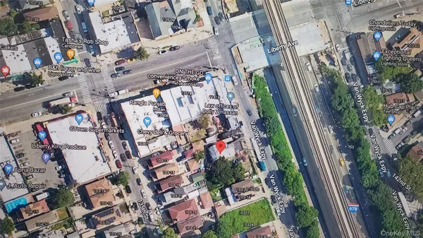 an aerial view of a residential apartment building with yard