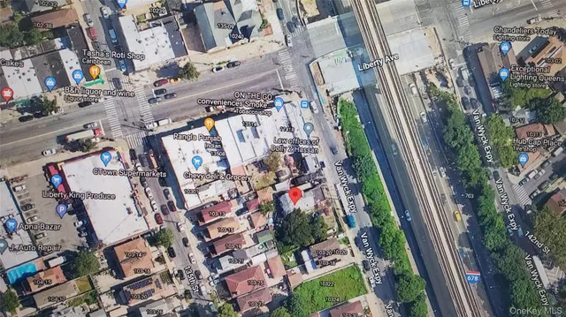 an aerial view of a residential apartment building with yard