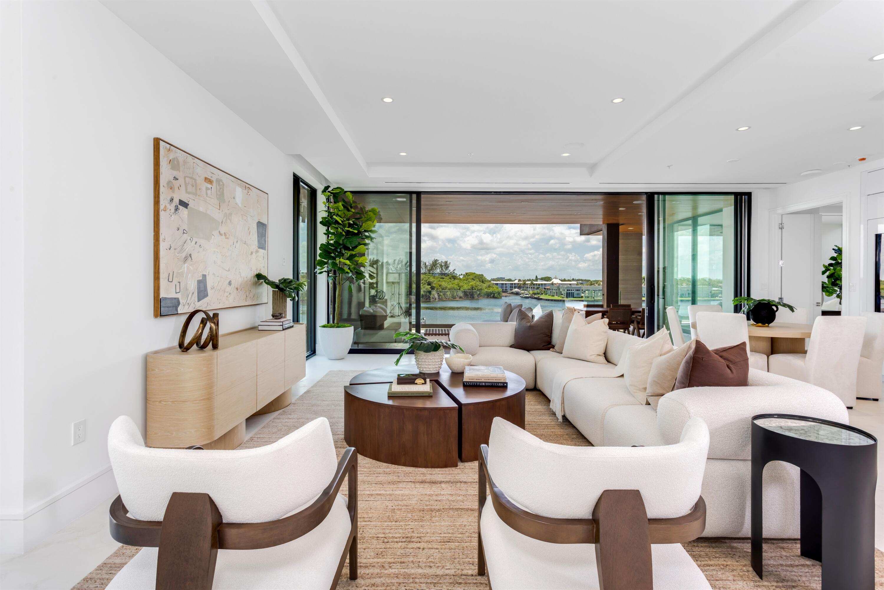 900 Lago Mar Lane, Unit PH Boca Raton, FL 33431 - Photo 6 of 58 a living room with furniture and a large window