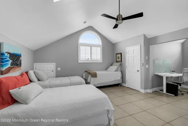 a bedroom with furniture and a chandelier