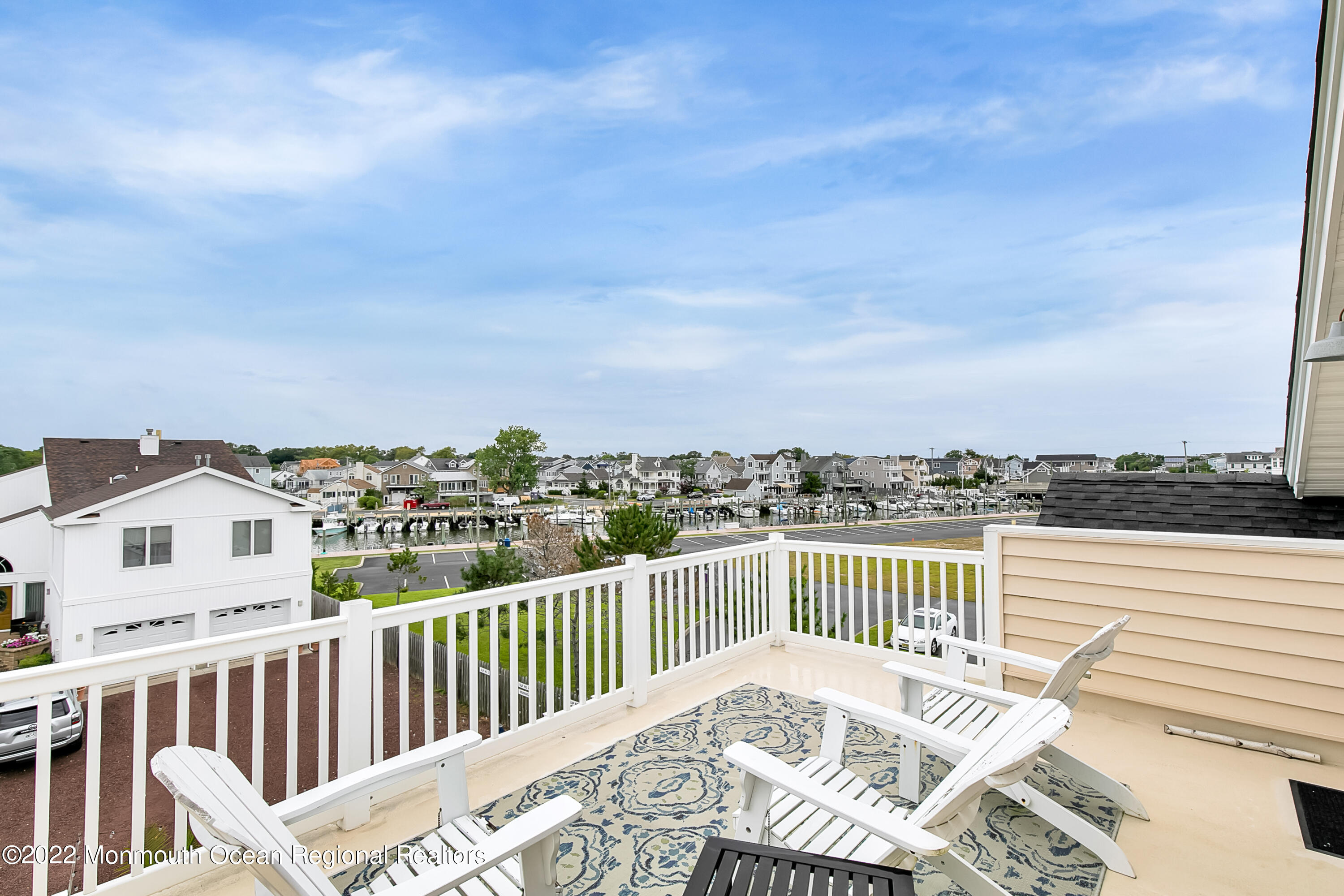 12 Captains Court Manasquan, NJ 08736 - Photo 22 of 30 a view of a balcony with wooden floor