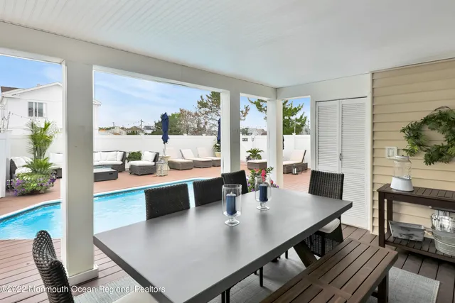 a swimming pool view with a garden space