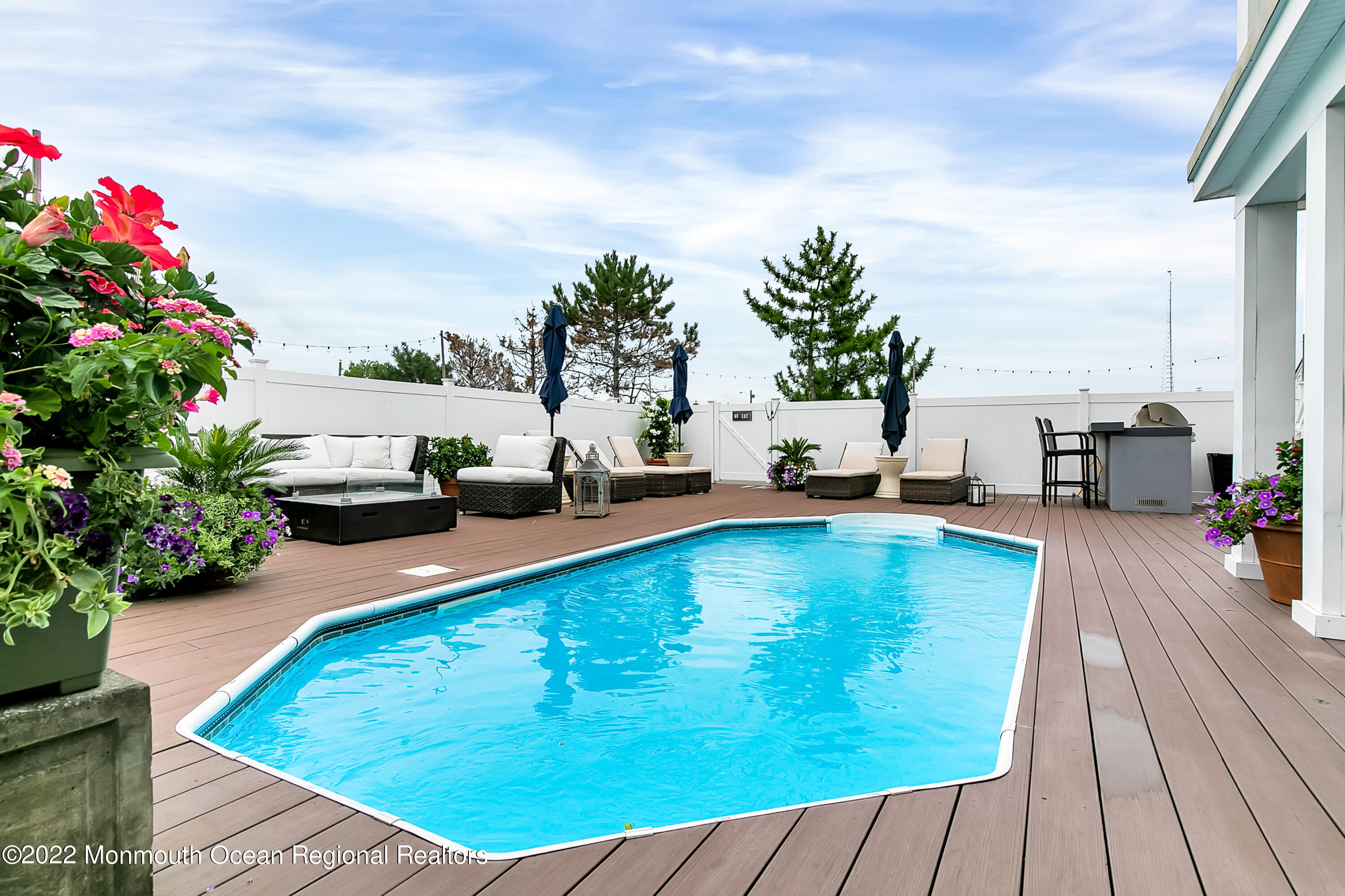 12 Captains Court Manasquan, NJ 08736 - Photo 28 of 30 a swimming pool view with a garden space