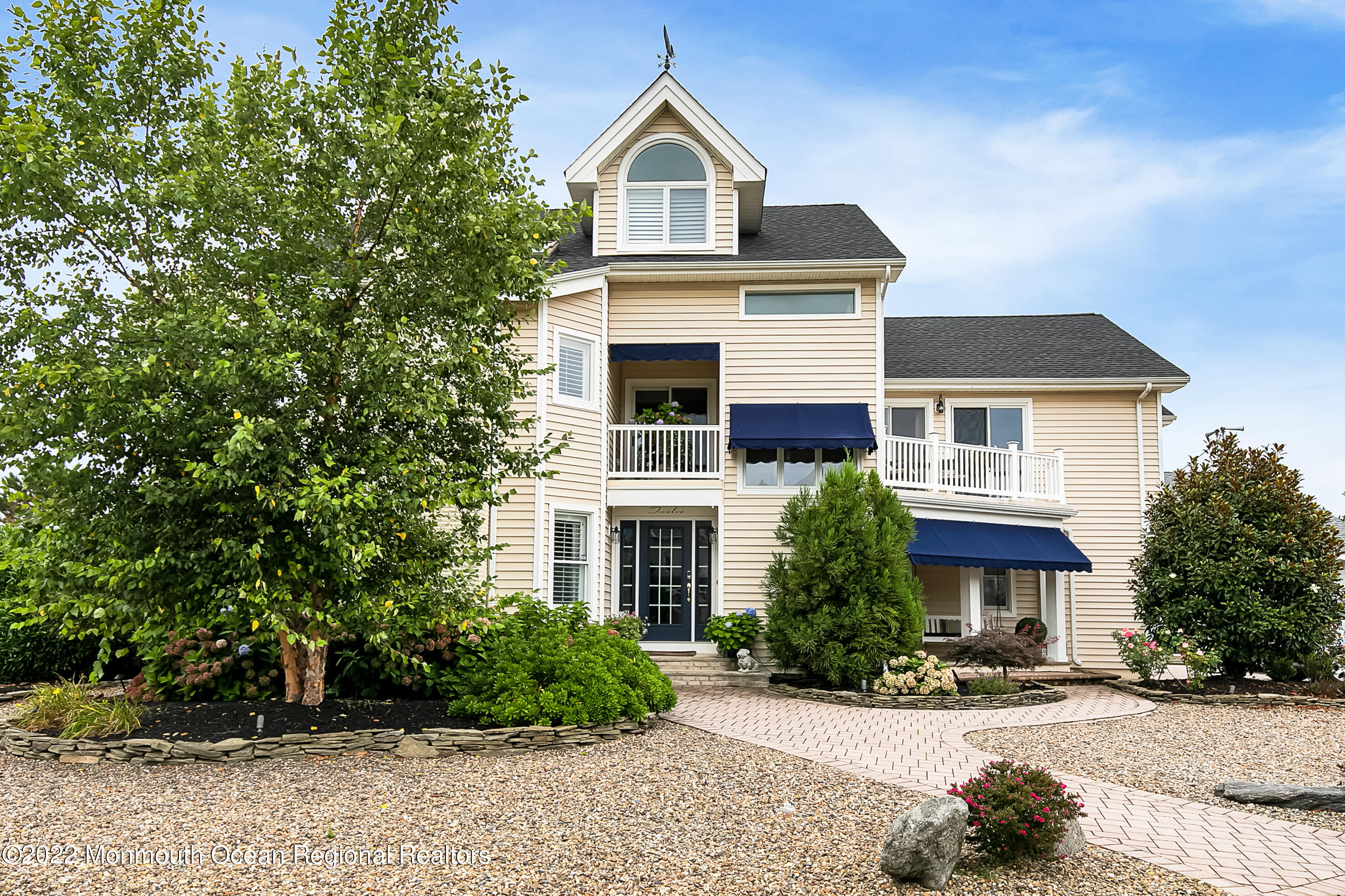 12 Captains Court Manasquan, NJ 08736 - Photo 4 of 30 a front view of a house with a yard