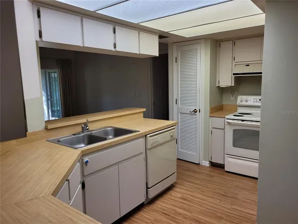 a kitchen with a sink and cabinets