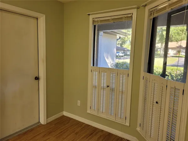 a view of front door with wooden floor