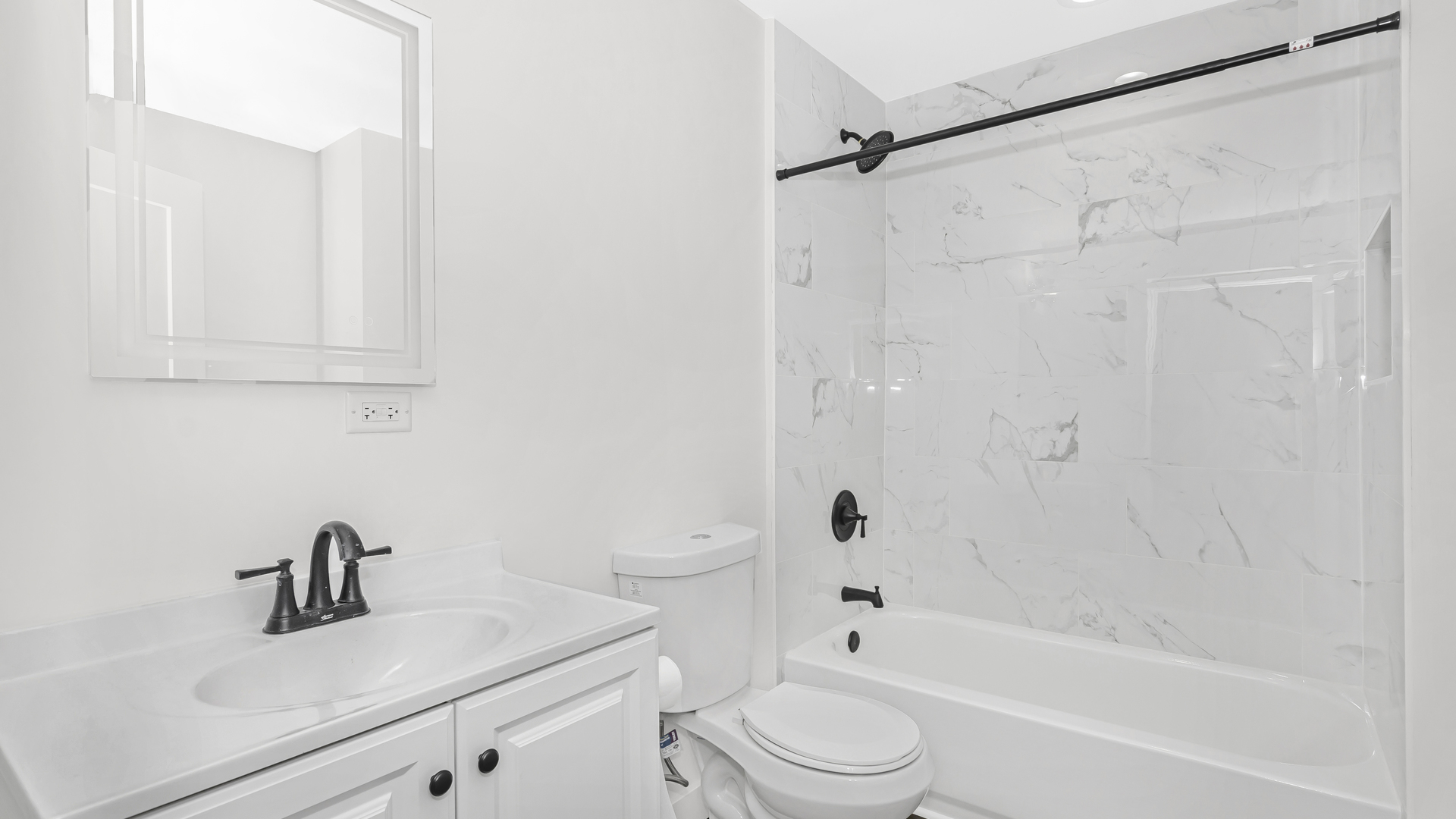 1925 South Racine Avenue, Unit 1F Chicago, IL 60608 - Photo 13 of 16 a bathroom with a sink a toilet and a bathtub