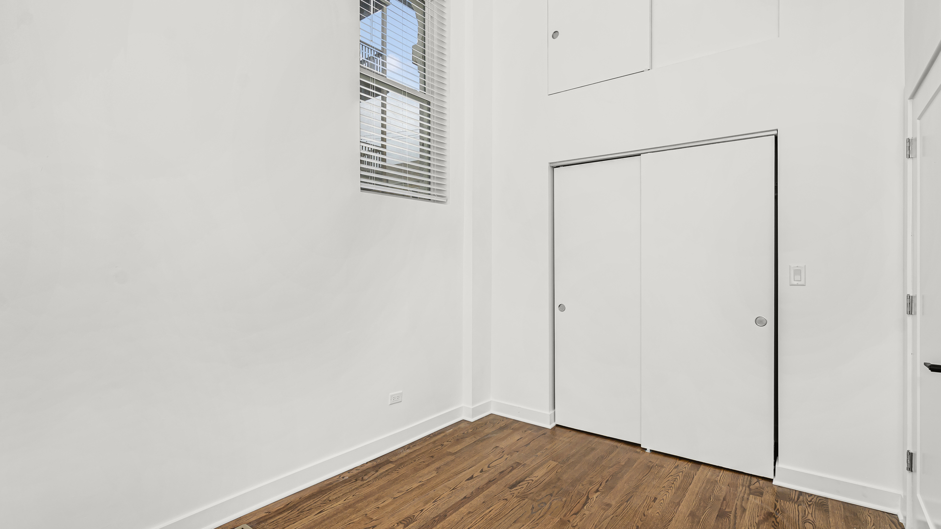 1925 South Racine Avenue, Unit 1F Chicago, IL 60608 - Photo 15 of 16 a view of an empty room with wooden floor