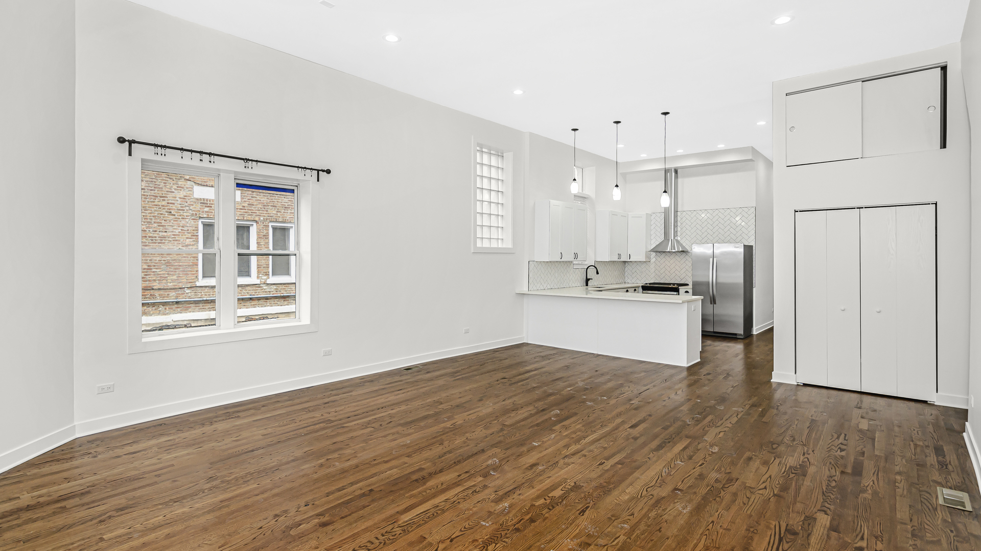 1925 South Racine Avenue, Unit 1F Chicago, IL 60608 - Photo 2 of 16 a view of kitchen with wooden floor and window