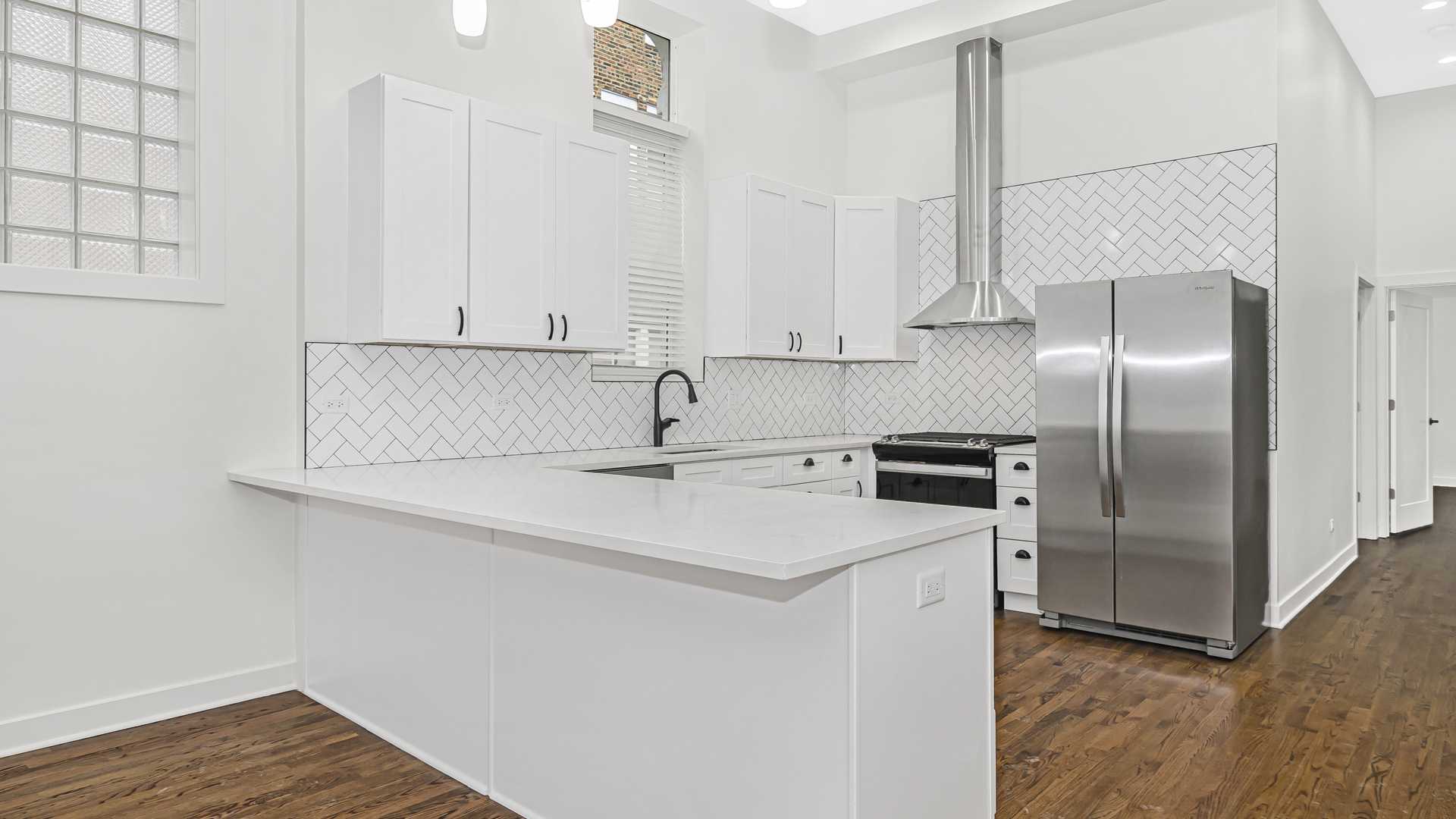 1925 South Racine Avenue, Unit 1F Chicago, IL 60608 - Photo 4 of 16 a kitchen with stainless steel appliances a refrigerator sink and microwave