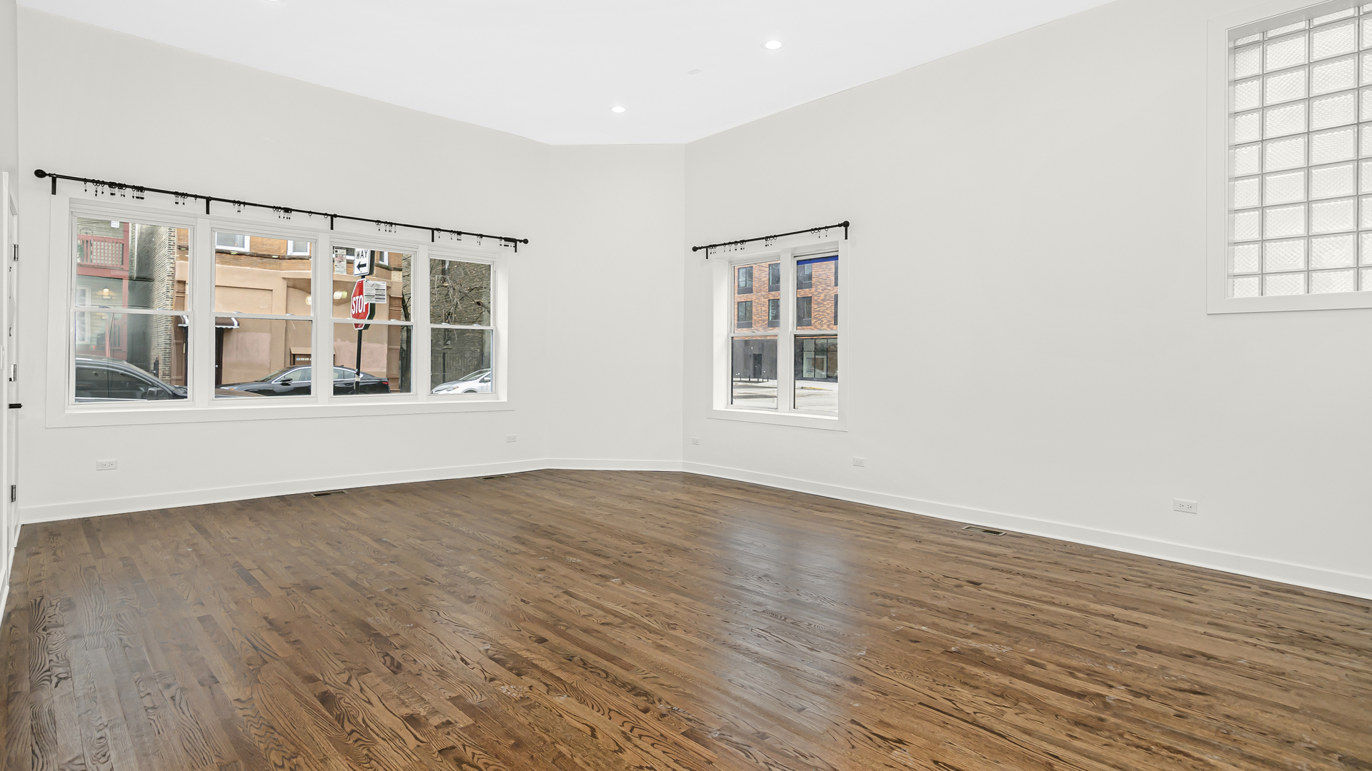 1925 South Racine Avenue, Unit 1F Chicago, IL 60608 - Photo 7 of 16 a view of an empty room with wooden floor and a window