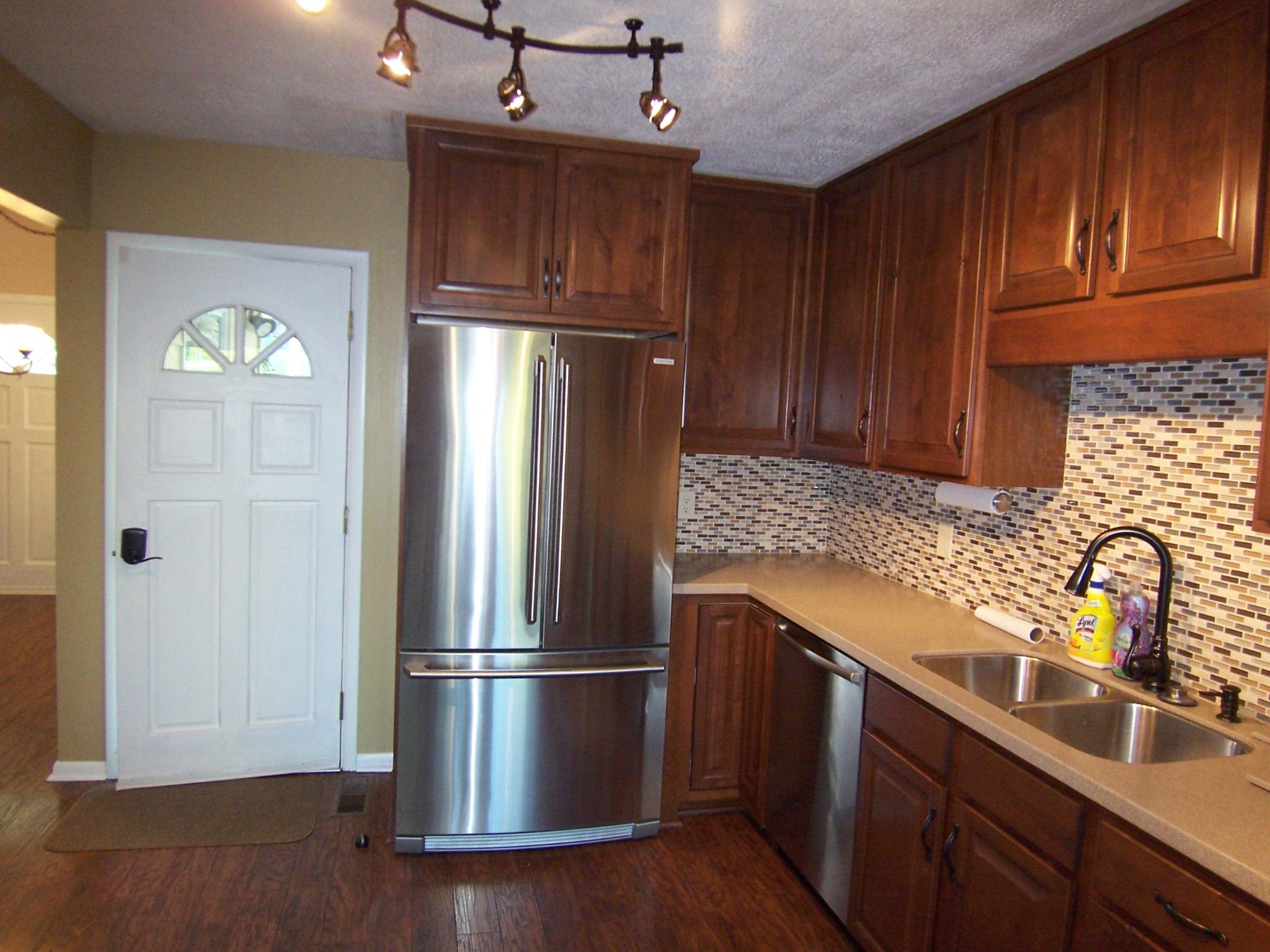 501 Robertsville Road Oak Ridge, TN 37830 - Photo 6 of 19 a kitchen with stainless steel appliances granite countertop a refrigerator a sink a stove and dishwasher with wooden floor