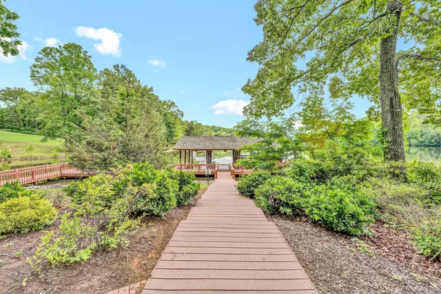 a view of a pathway both side of the house
