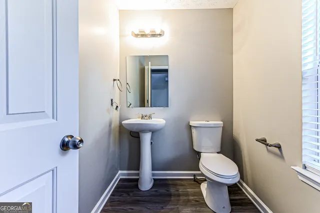 a bathroom with a sink toilet