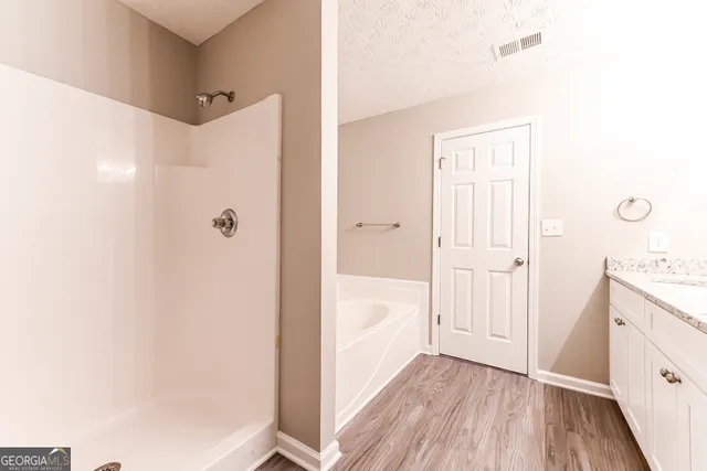 a bathroom with a sink and a bathtub