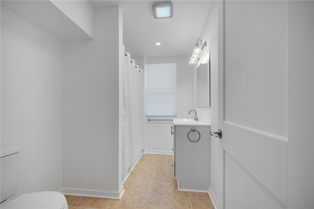 9360 West Ridge Road Clarkson, NY 14420 - Photo 23 of 34 1st level full bath with tub/shower--ALL NEW!!