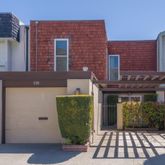 a view of a brick house with a outdoor space