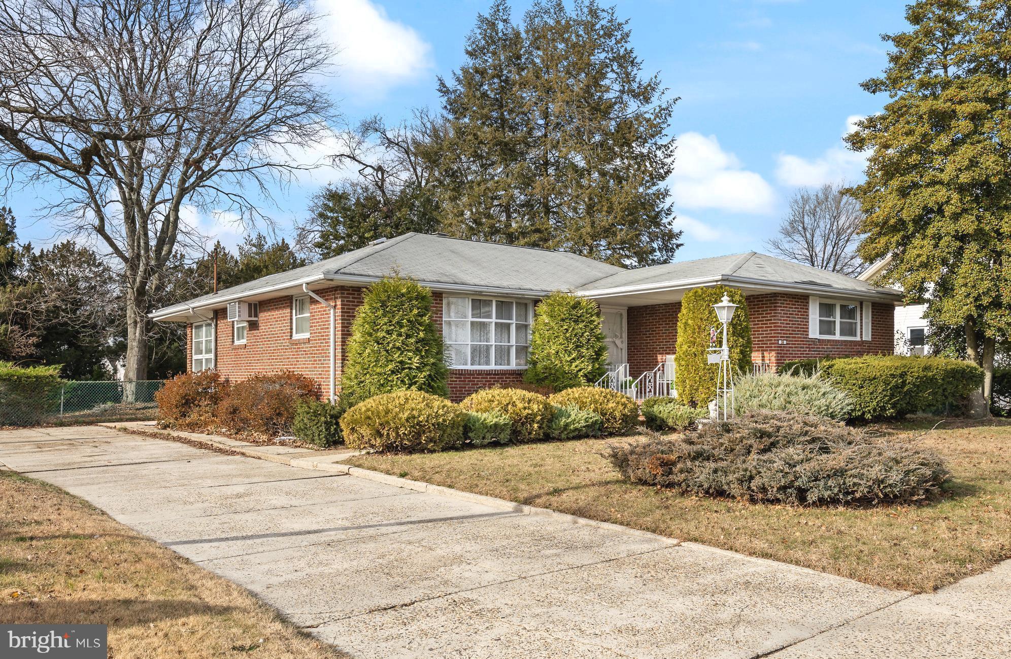 59 North Chester Avenue Delran, NJ 08075 - Photo 1 of 1 a front view of a house with a yard and potted plants