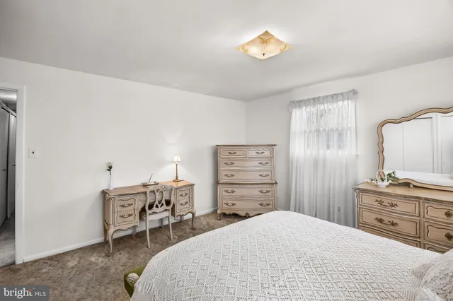 a bedroom with a bed and a cabinets