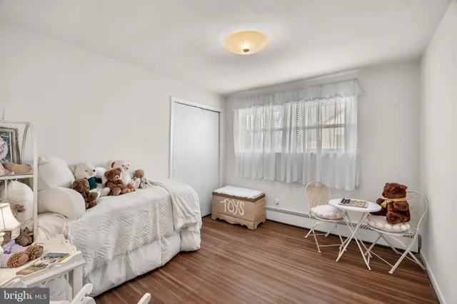 a bedroom with furniture and a window