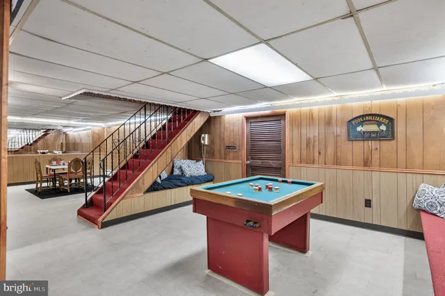 a room with stairs and furniture