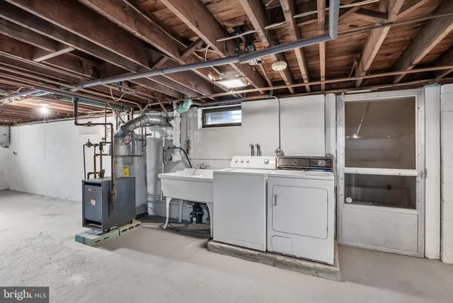 a utility room with dryer and washer