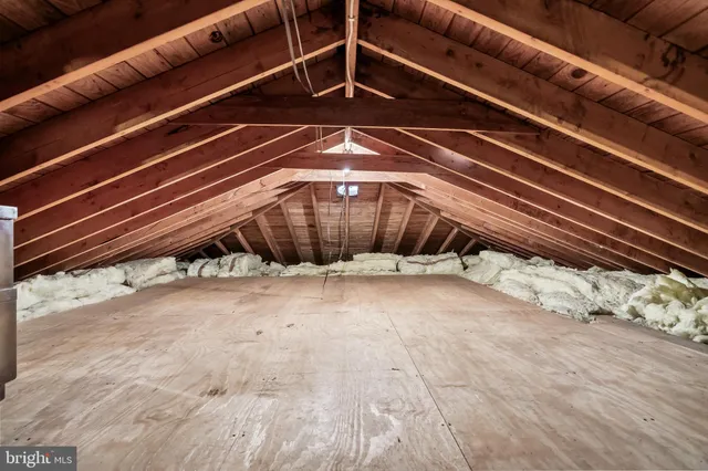 a outdoor space with a large window and furniture