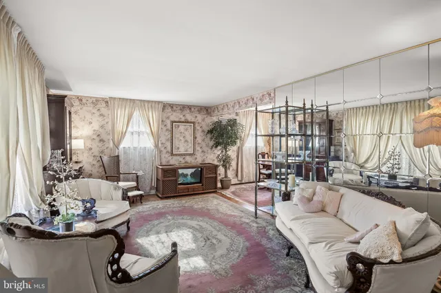 a living room with furniture large window and outer view