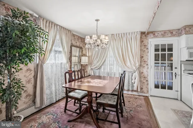 a dining room with furniture and window