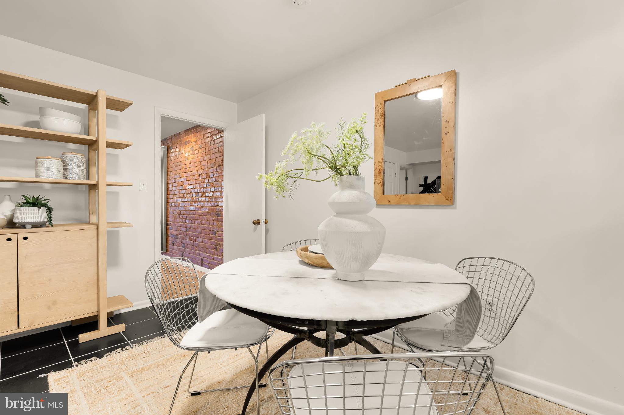 31 Florida Avenue Northeast Washington, DC 20002 - Photo 13 of 46 a view of a dining room with furniture and a potted plant