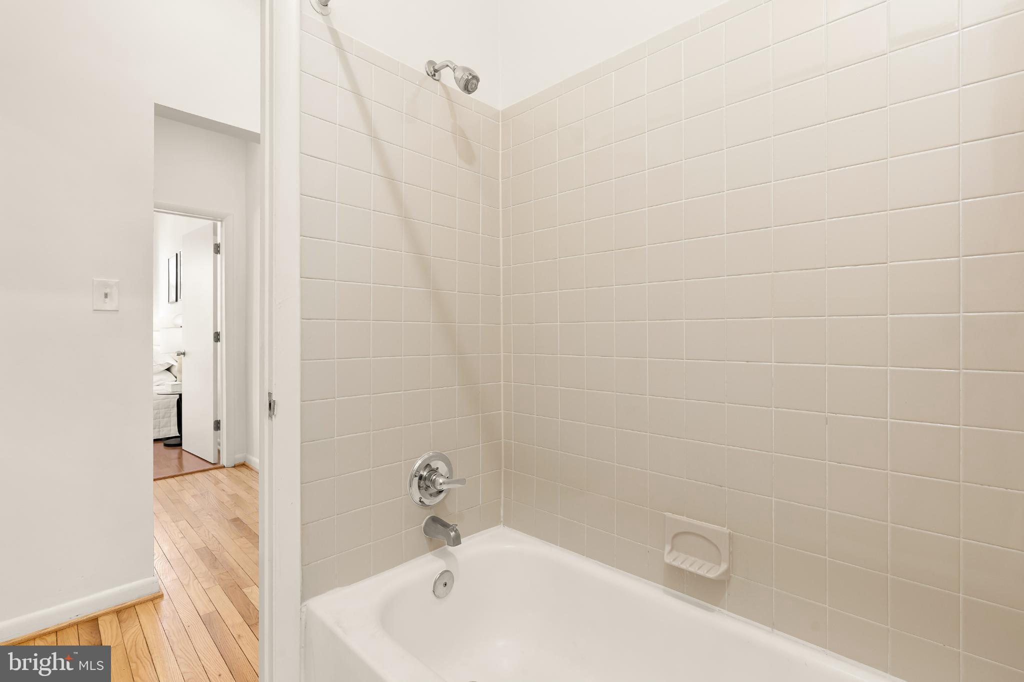 31 Florida Avenue Northeast Washington, DC 20002 - Photo 28 of 46 a bathroom with a tub and shower