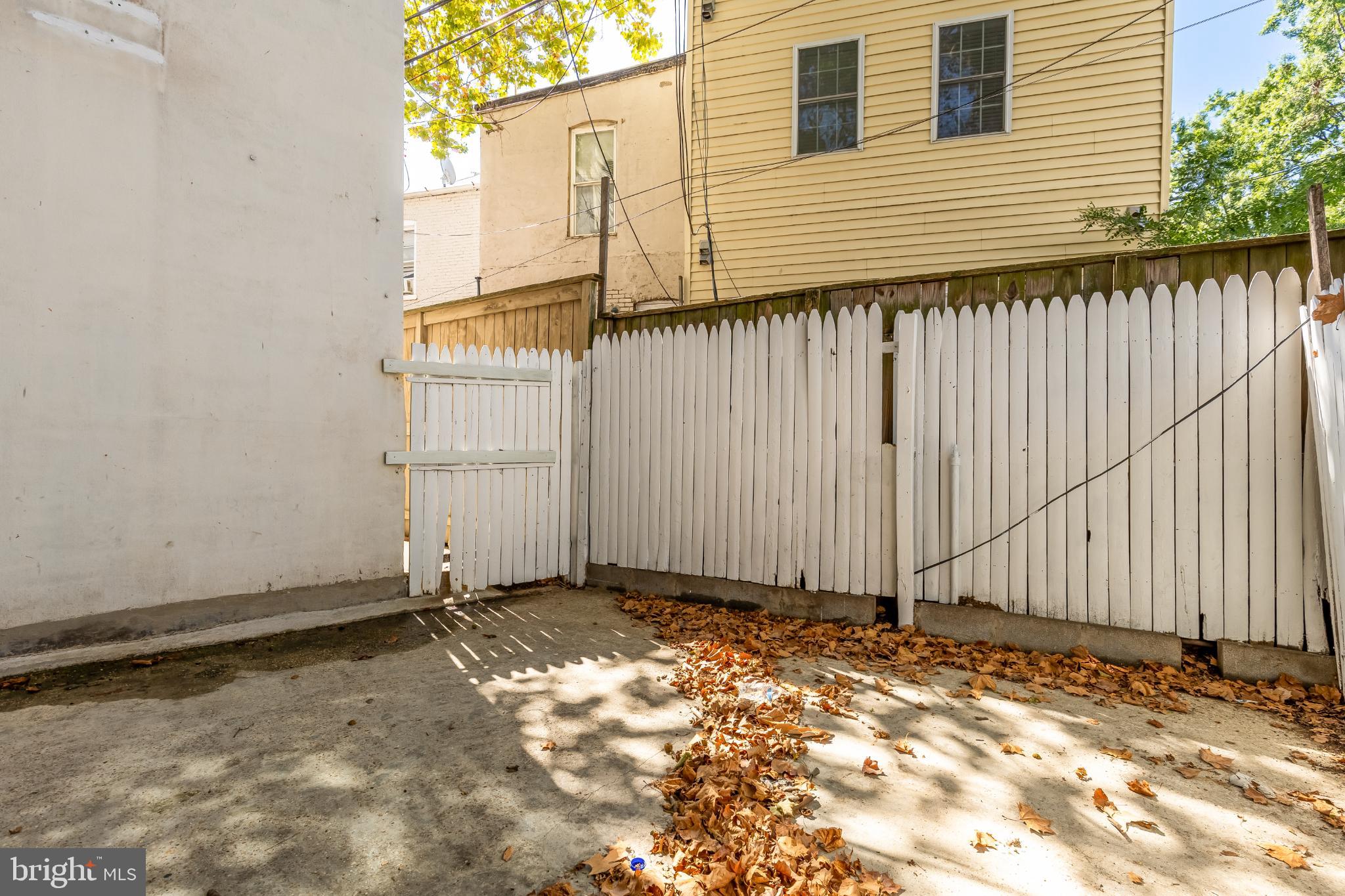 31 Florida Avenue Northeast Washington, DC 20002 - Photo 45 of 46 a view of a house with backyard and wooden fence